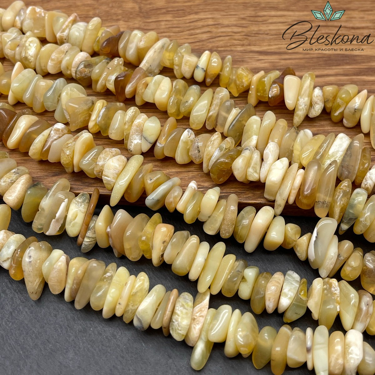 Опал желтый сколы шлифованные (3-7)*(10-16) мм