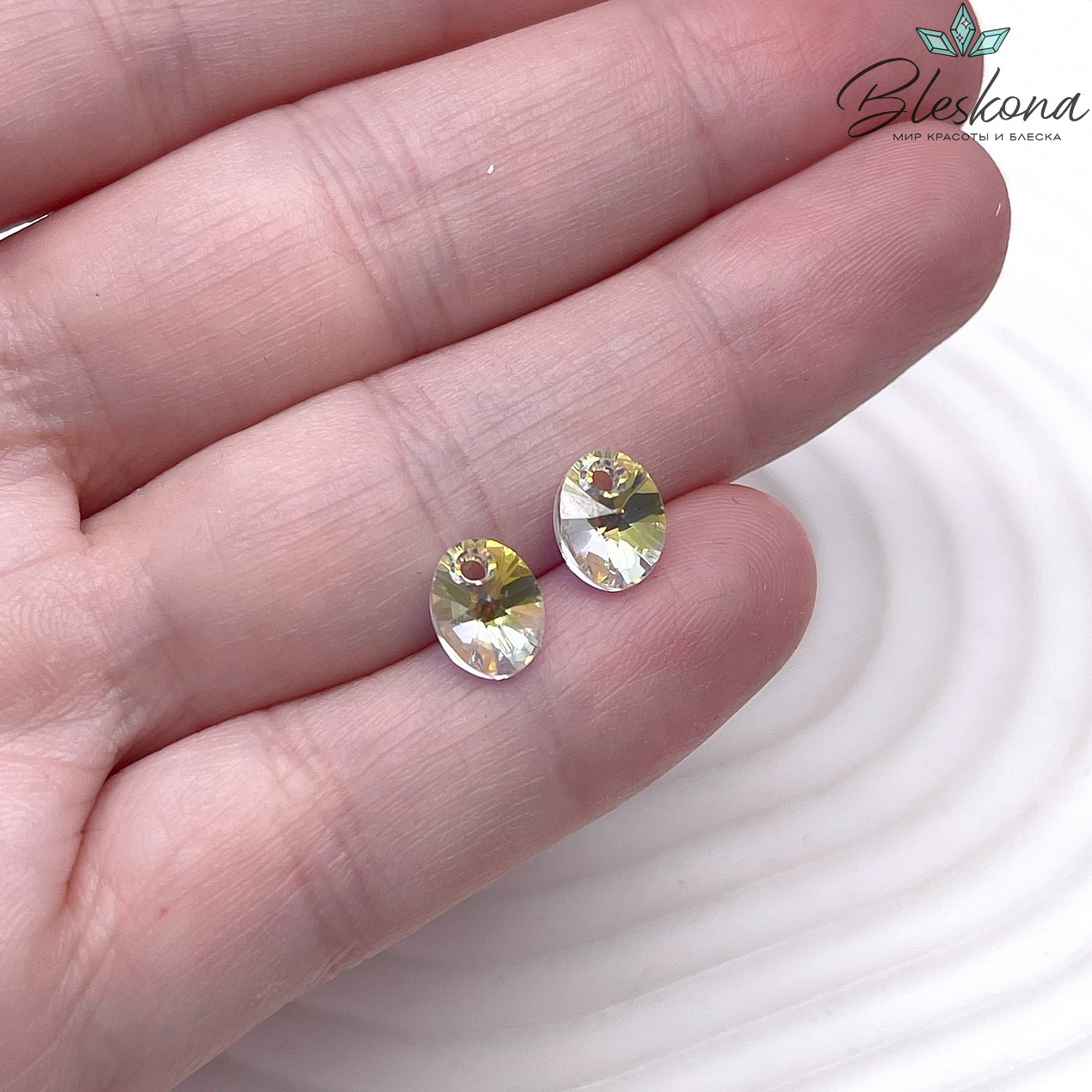 6028 XILION Oval 8 мм Crystal Aurore Boreale (AB)