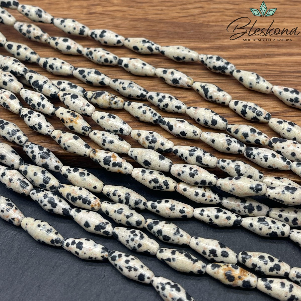 Яшма далматиновая (фенит) биконус 15*6 мм
