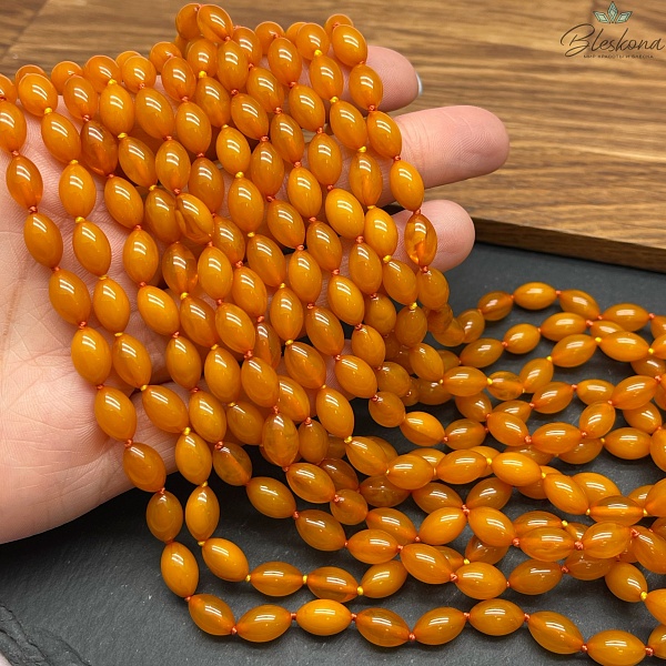 Янтарь оранжевый рис 9*6 мм
